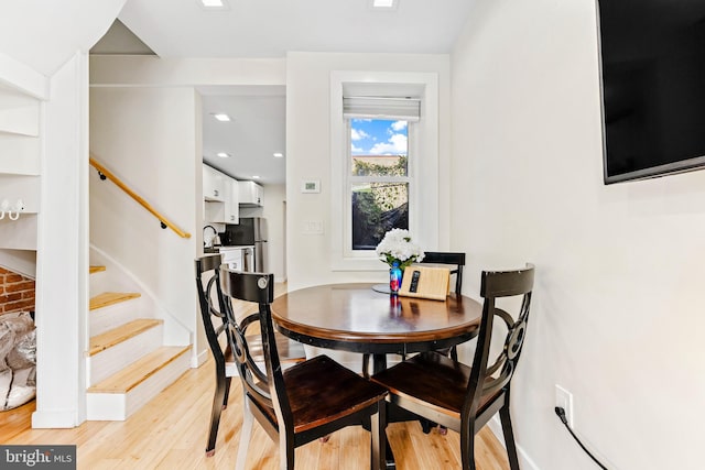 dining room with light hardwood / wood-style floors