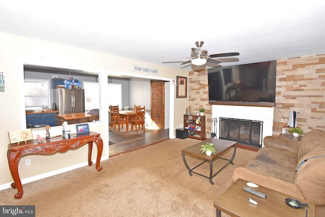 living room featuring wood-type flooring and ceiling fan