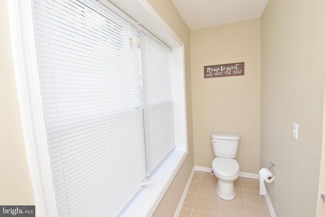 bathroom with tile patterned floors and toilet