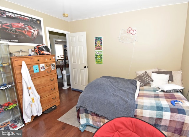 bedroom featuring dark hardwood / wood-style flooring