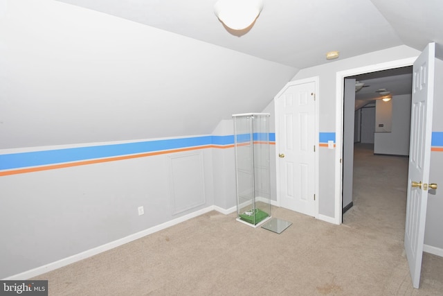 bonus room featuring light carpet and lofted ceiling