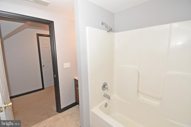 bathroom featuring shower / bath combination and vanity