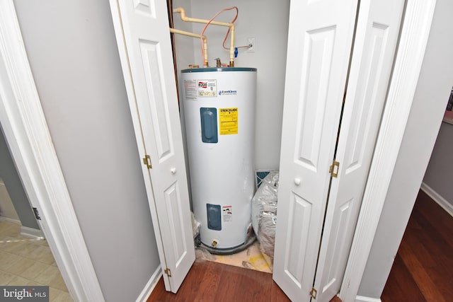 utility room with electric water heater