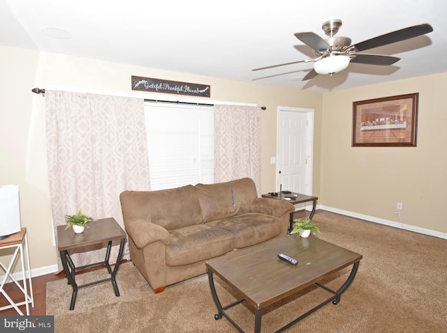 living room with ceiling fan and light colored carpet