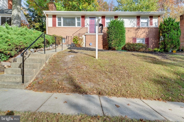 view of front of property with a front lawn