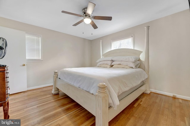 bedroom featuring light hardwood / wood-style floors and ceiling fan