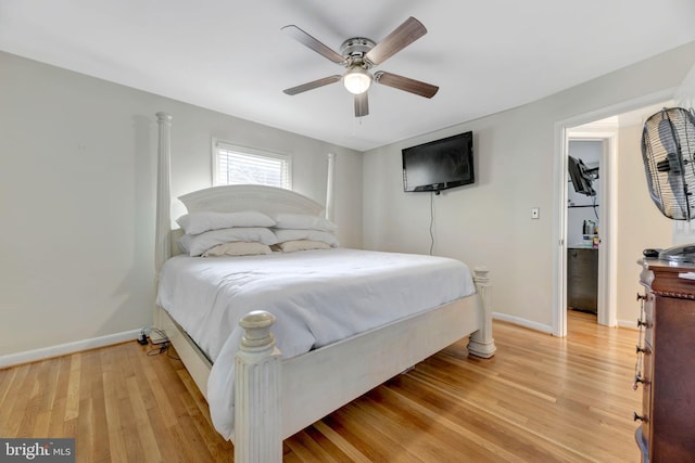 bedroom with light hardwood / wood-style floors and ceiling fan