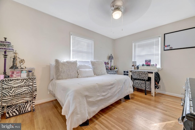 bedroom featuring light wood-type flooring and ceiling fan