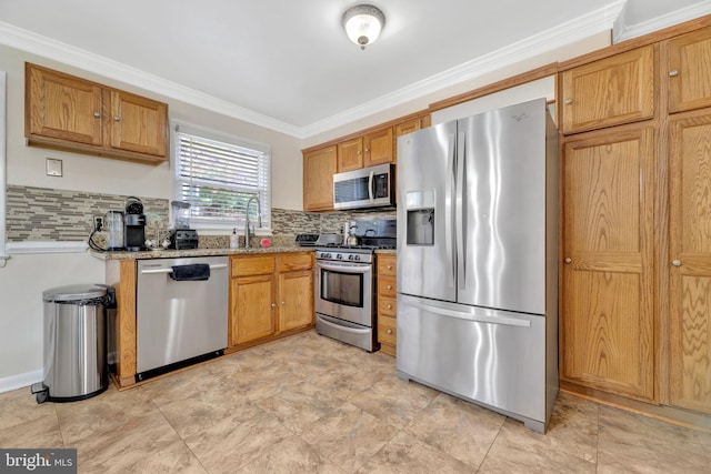 kitchen with decorative backsplash, light stone countertops, ornamental molding, sink, and stainless steel appliances