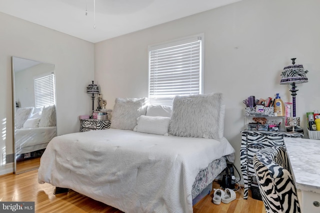 bedroom with hardwood / wood-style floors