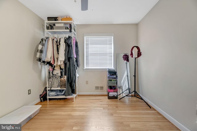 exercise room featuring light hardwood / wood-style flooring