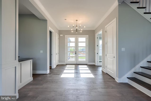 foyer featuring dark wood-style flooring, baseboards, french doors, stairway, and crown molding