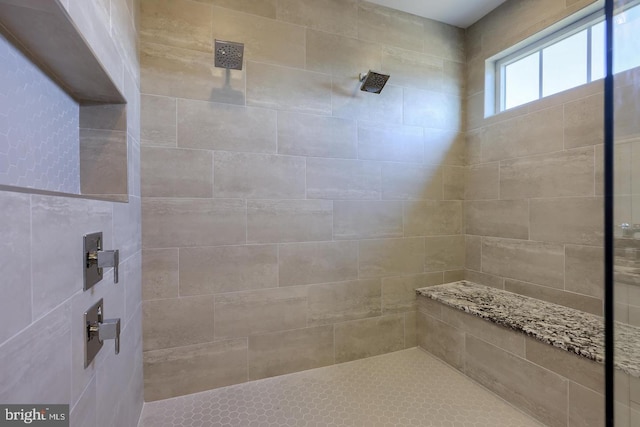 full bathroom with a tile shower