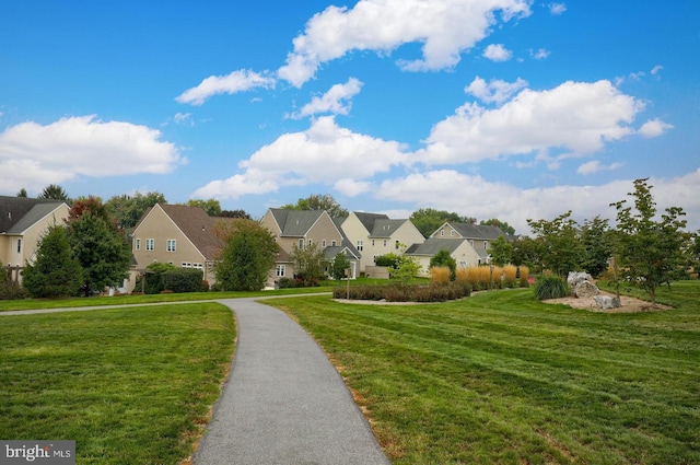 view of front of home featuring a front lawn and a residential view