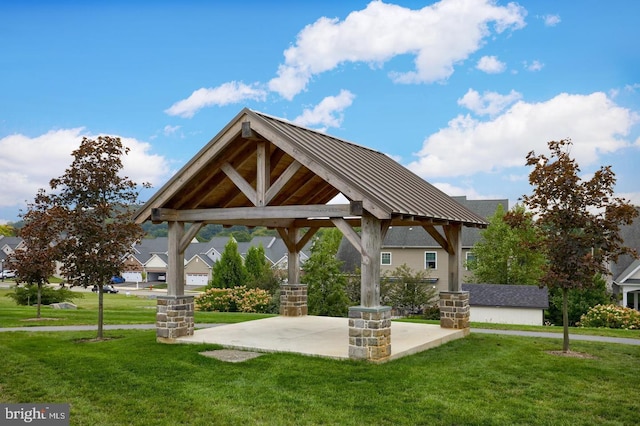 view of community with a lawn, a gazebo, and a patio