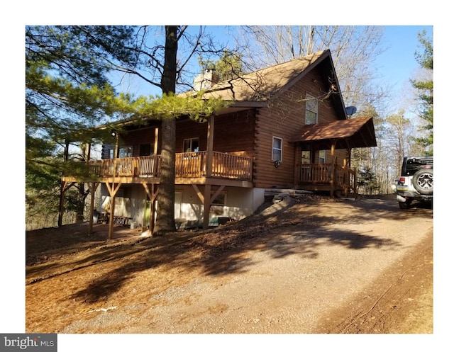 view of log cabin