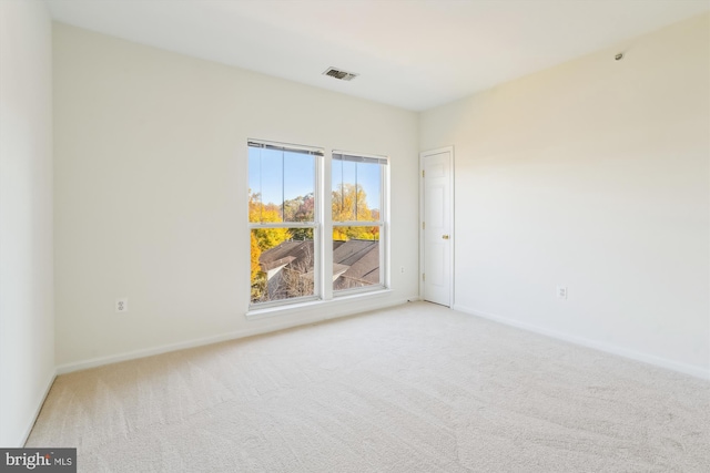 spare room with light colored carpet