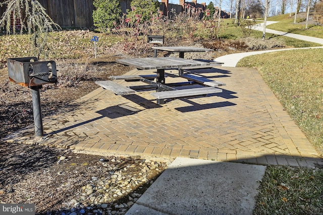 view of home's community with a yard and a patio