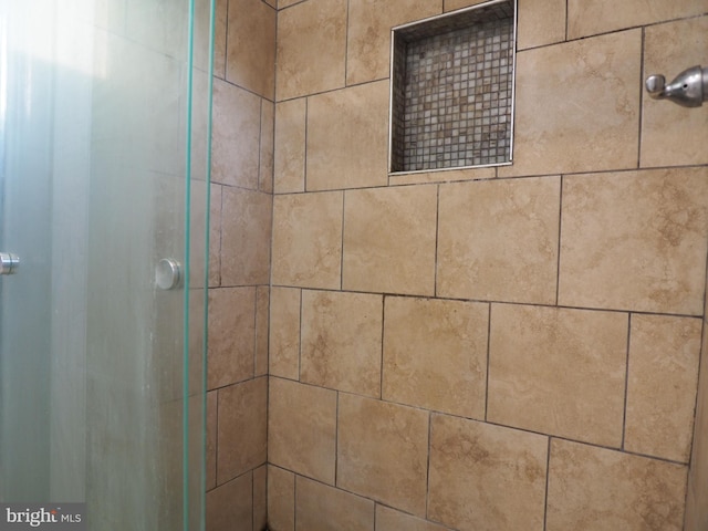 details featuring an enclosed shower