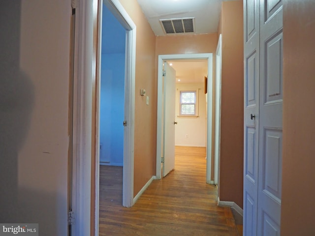 hall with dark hardwood / wood-style flooring