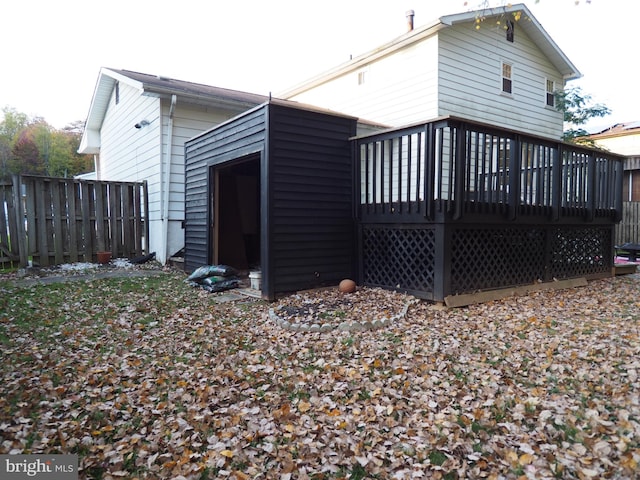 back of house featuring a deck