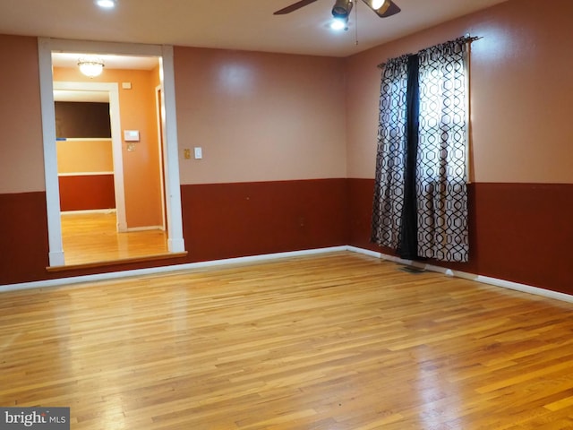 empty room featuring light hardwood / wood-style flooring and ceiling fan