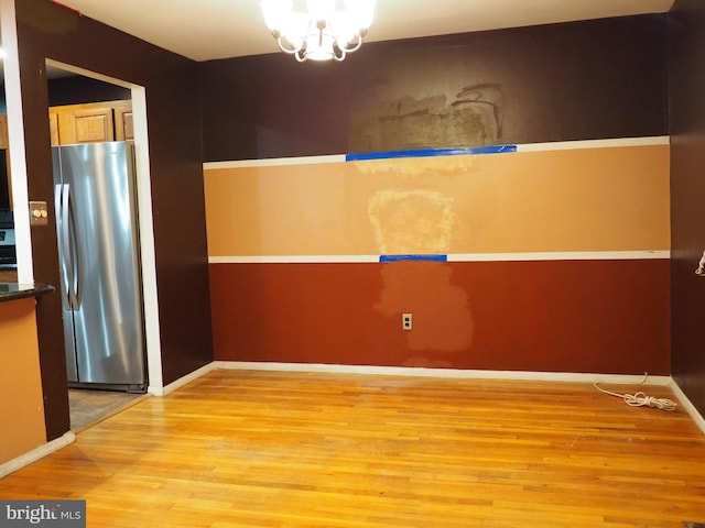 interior space with light hardwood / wood-style flooring and a chandelier