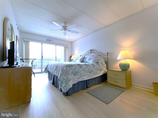 bedroom featuring ceiling fan, access to outside, and light hardwood / wood-style floors