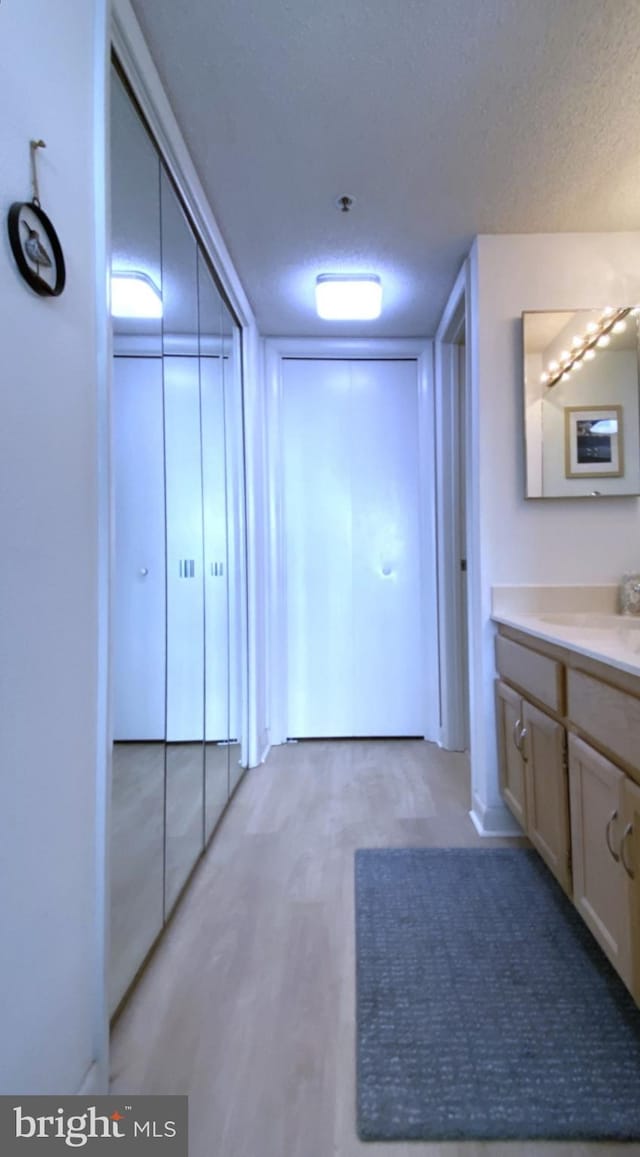 bathroom with vanity and a textured ceiling