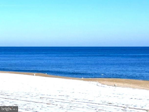 view of water feature with a beach view