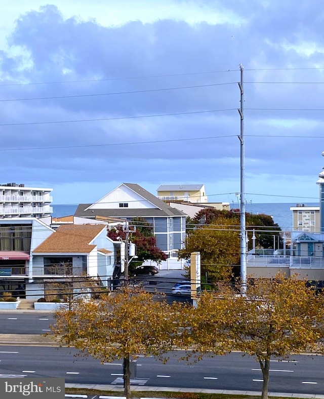 view of front facade with a water view