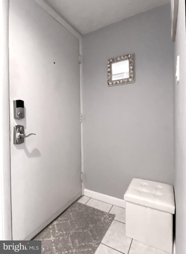 bathroom featuring tile patterned floors and toilet