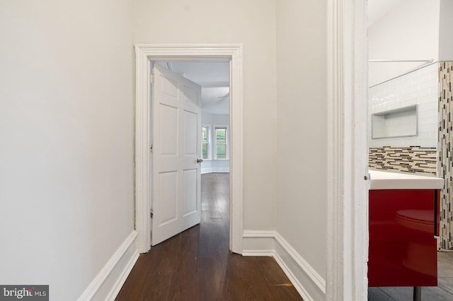 hall with dark hardwood / wood-style flooring