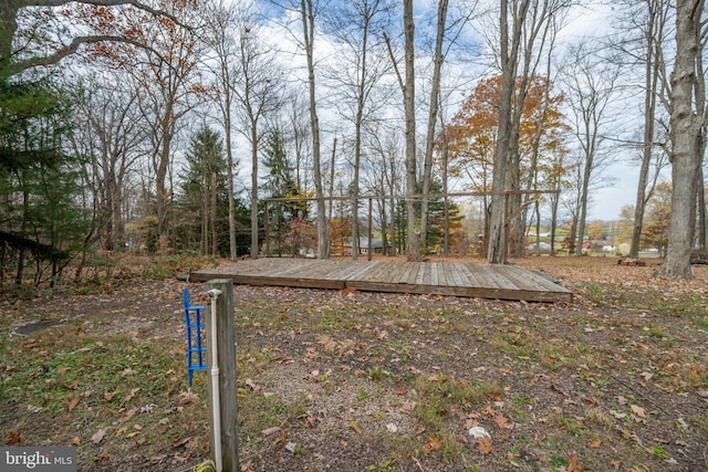 view of yard with a wooden deck