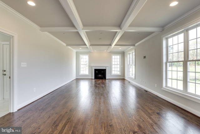 unfurnished living room featuring crown molding, dark hardwood / wood-style floors, beam ceiling, and coffered ceiling