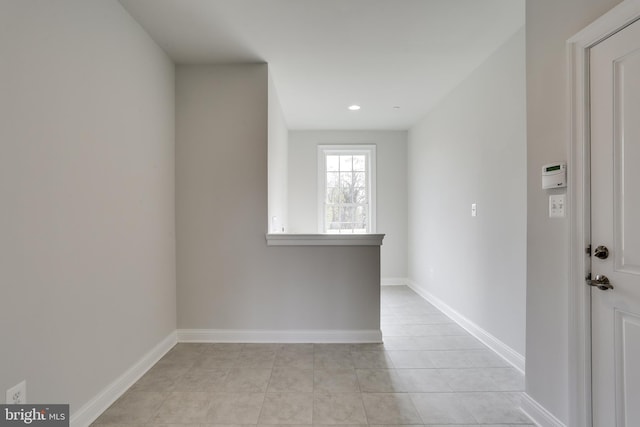 empty room featuring light tile patterned floors