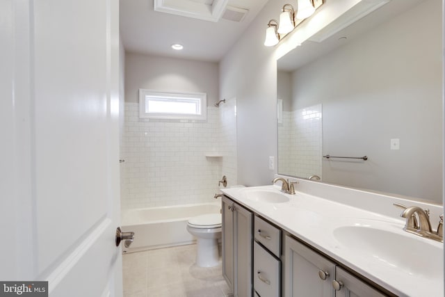 full bathroom with toilet, tiled shower / bath combo, vanity, and tile patterned flooring