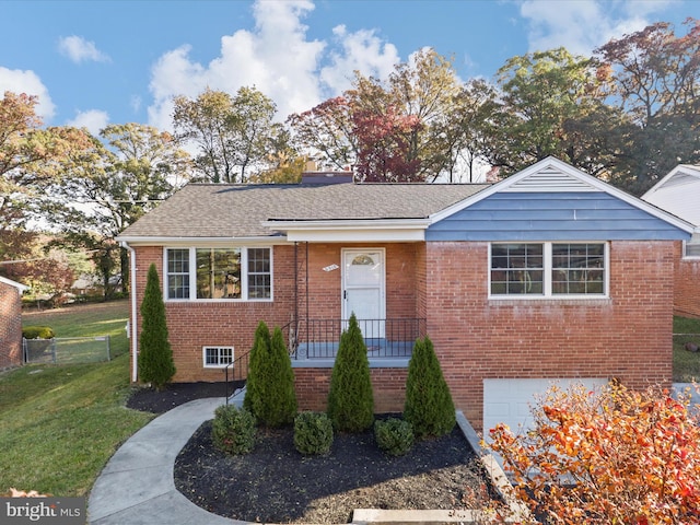 view of front of house featuring a front yard and a garage