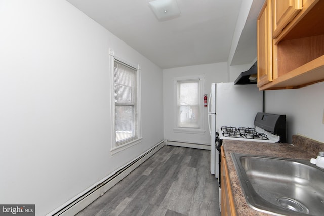 kitchen with baseboard heating, sink, range hood, and dark wood-type flooring