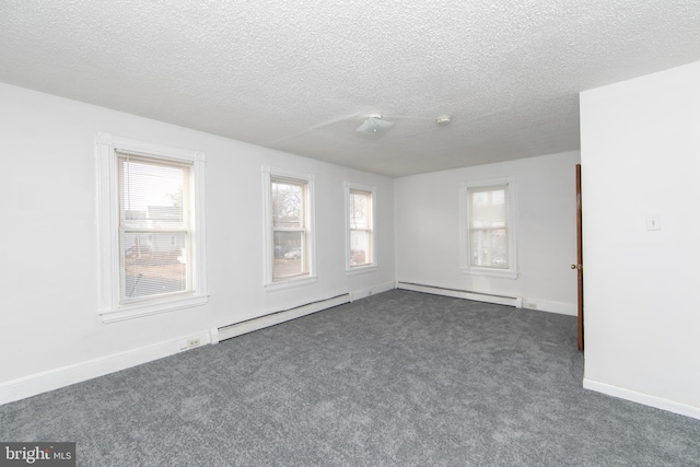 unfurnished room with a baseboard radiator, a textured ceiling, and dark carpet