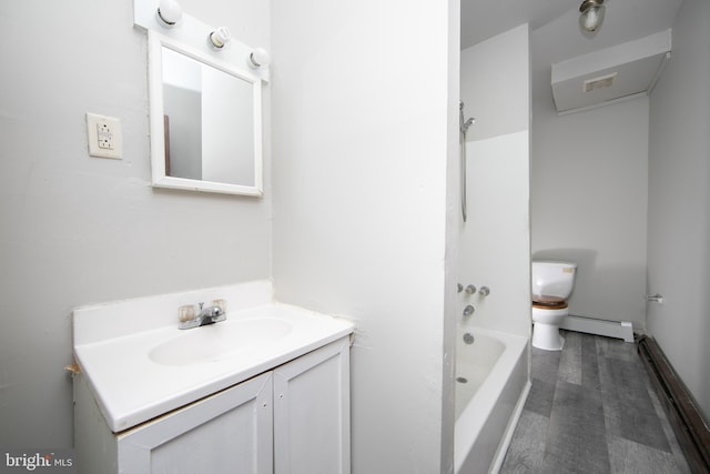 full bathroom with  shower combination, vanity, a baseboard heating unit, hardwood / wood-style flooring, and toilet