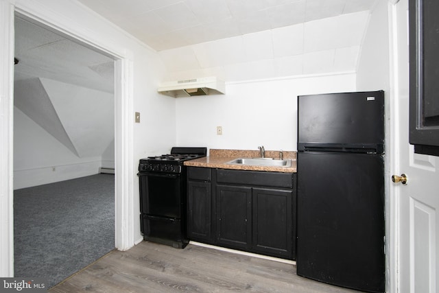 kitchen featuring light carpet, ventilation hood, vaulted ceiling, sink, and black appliances