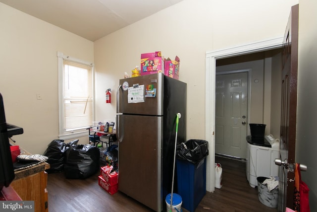 kitchen featuring stainless steel refrigerator and dark wood-type flooring