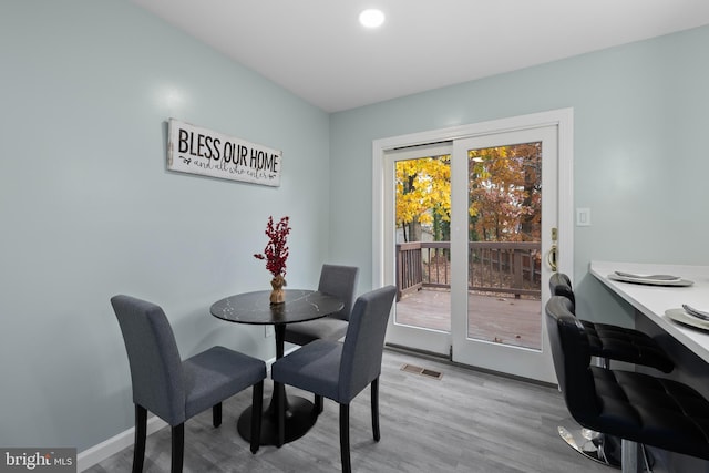 dining area with light wood-type flooring