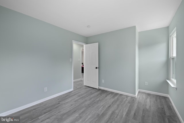 unfurnished room with light hardwood / wood-style floors