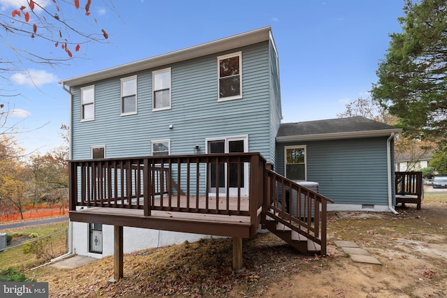 back of house with a wooden deck