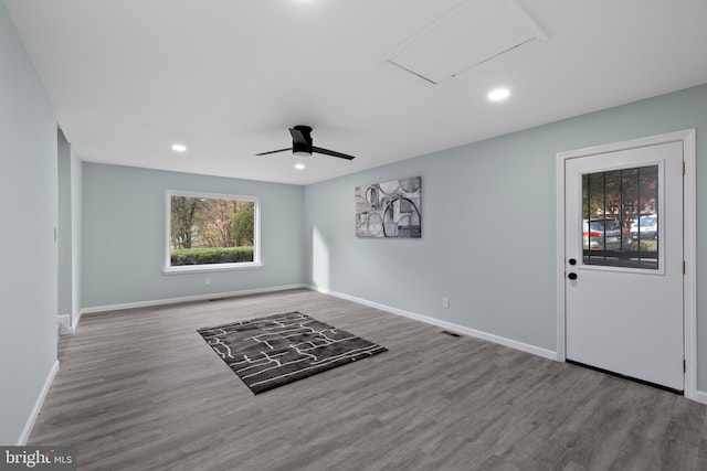 spare room featuring hardwood / wood-style floors and ceiling fan