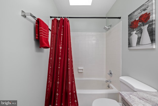 full bathroom with shower / bath combo, vanity, and toilet