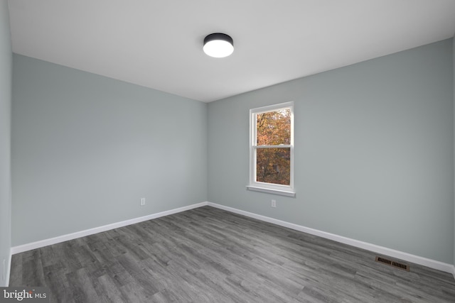 unfurnished room featuring hardwood / wood-style floors