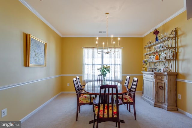 carpeted dining area featuring ornamental molding and a chandelier